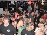 a group of people in a bar